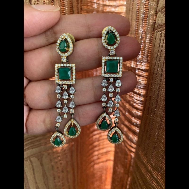 Trendy green black metal and gold finish AD earrings