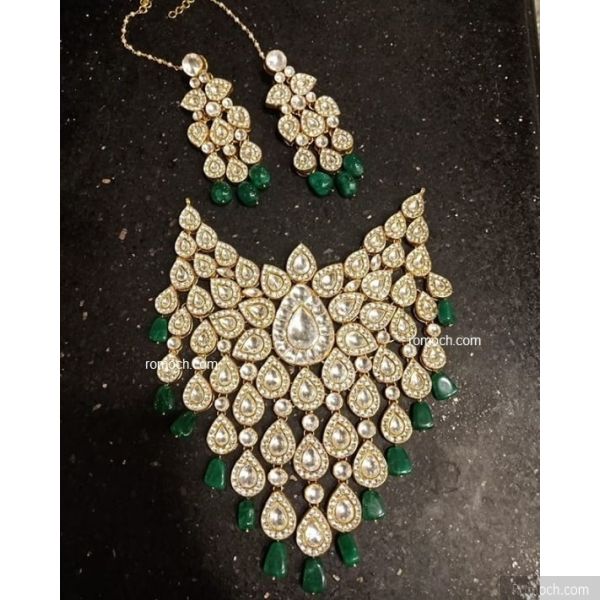 Polki Kundan bridal set in pan shape droplet design and green drops