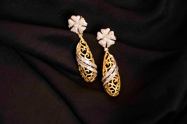 CZ stone goldegnn tone earrings intricate design