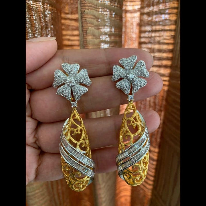 CZ stone goldegnn tone earrings intricate design