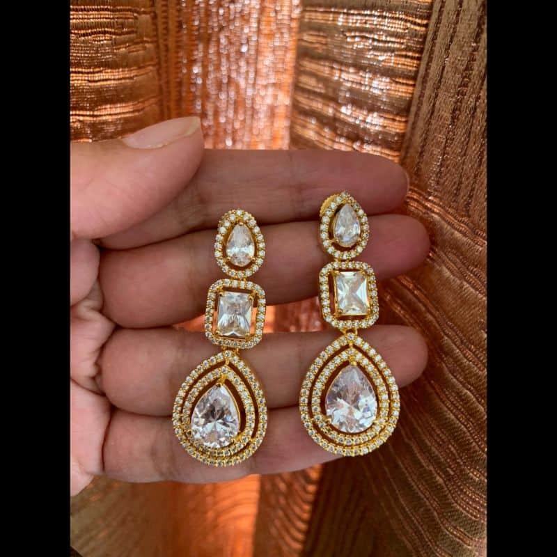 Trendy CZ stone golden tone dangle earrings