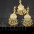 Jadau Kundan gold tone circular design tikka and earrings set pipal patti drops